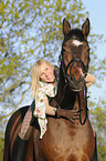 woman rides Bavarian warmblood