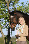 woman and Bavarian warmblood