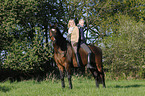 women and Bavarian warmblood