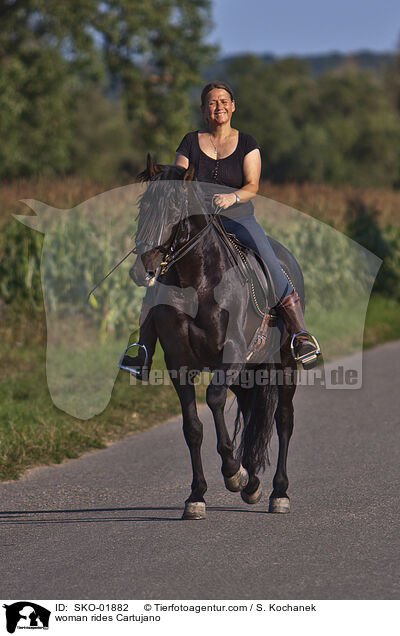 woman rides Cartujano / SKO-01882
