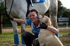 woman with horse and dog