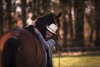 woman and Dutch Warmblood