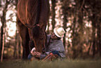 woman and Dutch Warmblood