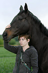woman and english thoroughbred