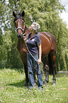 woman and english thoroughbred