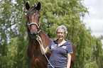 woman and english thoroughbred