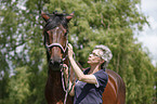 woman and english thoroughbred