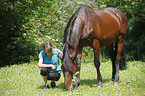 woman and english thoroughbred