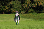 woman rides english thoroughbred