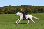 woman rides english thoroughbred