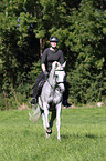 woman rides english thoroughbred