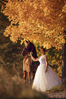 woman with english thoroughbred