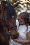 woman with english thoroughbred