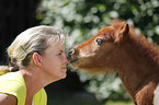 woman and Falabella foal