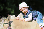 Baby on horses back