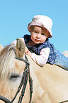 Baby on horses back