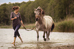 Woman with fjord horse