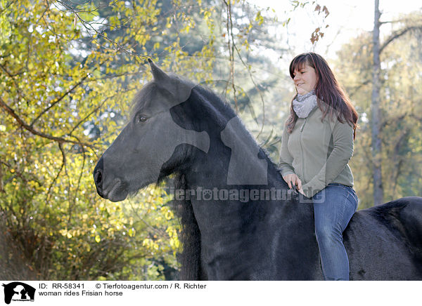 Frau reitet Friese / woman rides Frisian horse / RR-58341