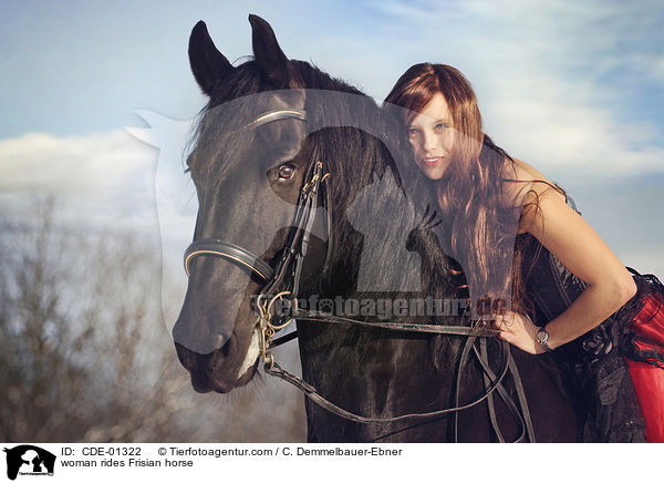woman rides Frisian horse / CDE-01322