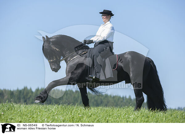 woman rides Friesian horse / NS-06549