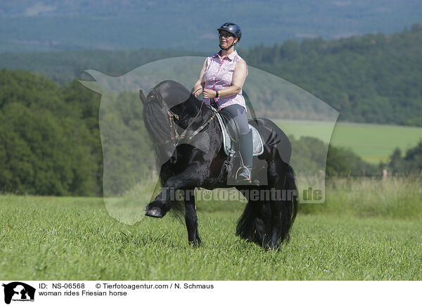 Frau reitet Friese / woman rides Friesian horse / NS-06568