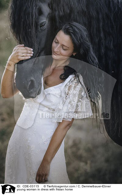 young woman in dress with frisian horse / CDE-03115