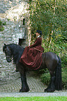 Friesian horse with horsewoman