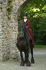 Friesian horse with horsewoman