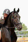 woman and frisian horse