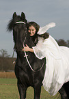 angel and friesian horse