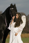 angel and friesian horse