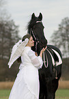 angel and friesian horse