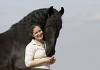 woman and frisian horse