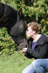 woman with Friesian horse