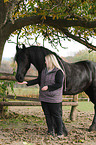 womn with Frisian horse