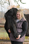 womn with Frisian horse