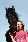 girl and Friesian horse