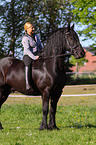 woman with Friesian horse