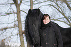 woman with Frisian horse