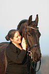 woman and Friesian horse