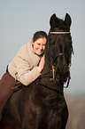 woman and Friesian horse