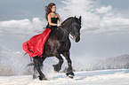 woman rides Frisian horse