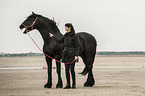 woman and Frisian Horse