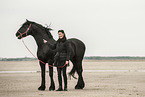 woman and Frisian Horse