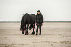 woman and Frisian Horse