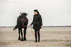 woman and Frisian Horse