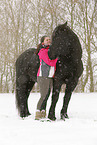 young woman with Frisian Horse