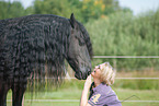 woman and Friesian Horse