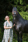 woman and Friesian Horse