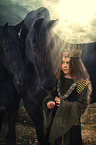 Friesian horses with child